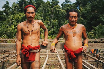 Two Men Wearing Red Tribal Clothing