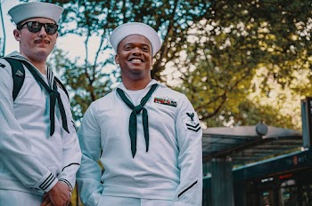 Two Men Wearing Sailor Uniforms
