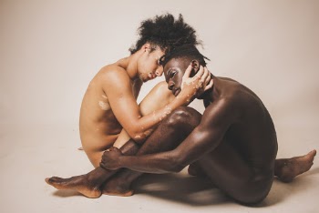Two Naked Men Sitting Beside Each Other