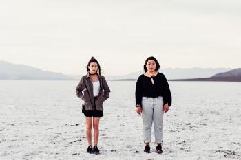 Two of my good friends pose neutrally in a very wide and empty Death Valley. 