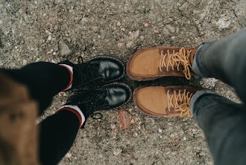 Two Pairs of Brown and Black Boots