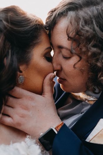 two people about to kiss closeup photography