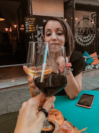 Two People Cheering Their Wine Glasses