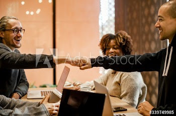 Two people giving a fist bump