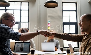 Two people giving a fist bump