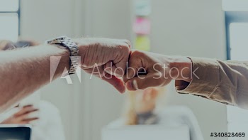Two people giving a fist bump