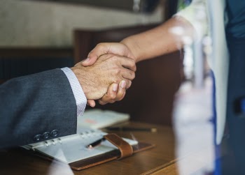 Two People Handshaking