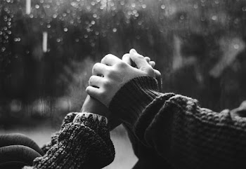 Two People Holding Each Other's Hands