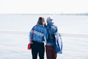 Two People Looking at the Beach