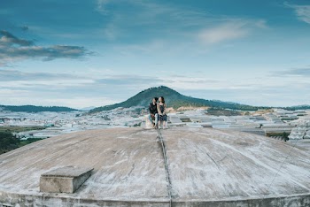 Two People on a Gray Cement Roof