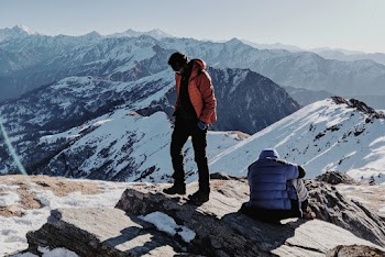 Two People on Top of a Mountain