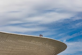 Two People on Top of Building