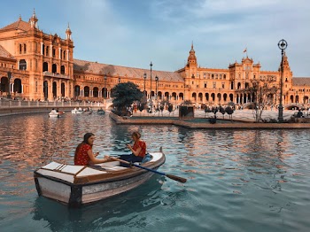 Two People Riding Boat