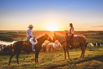 Two People Riding Horses