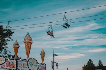 Two People Riding on Cable Car