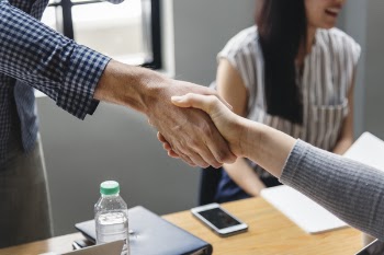 Two People Shaking Each Other's Hands