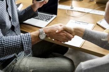 Two People Shaking Hands