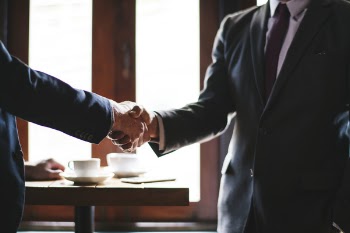 Two People Shaking Hands