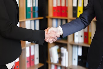 Two People Shaking Their Hands