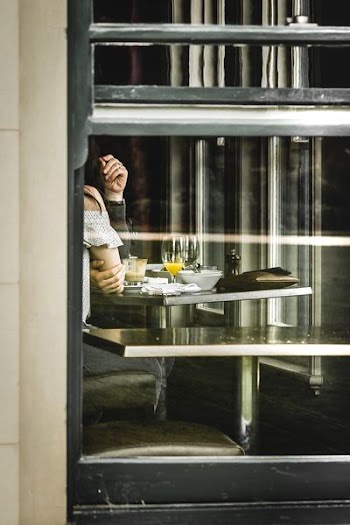 two people sitting near table