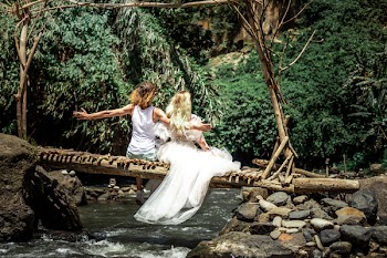 Two People Sitting on Log