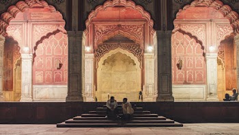 Two People Sitting on Stairs