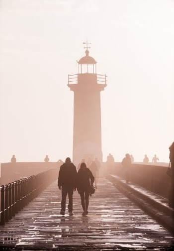 Two People Walking Near Lighthouse · Free Stock Photo
