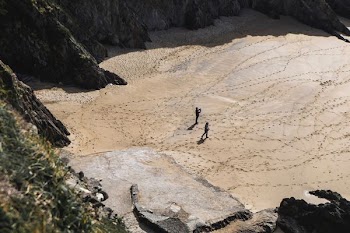 two people walking on desert