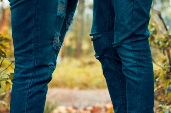 Two People Wearing Rugged Jeans 