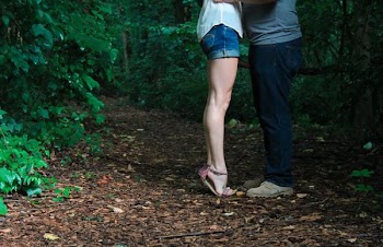 two person facing each other surround by trees