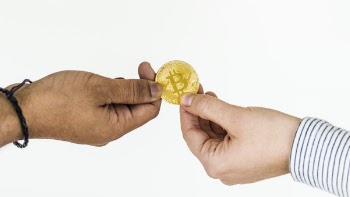 Two Person Holding Bitcoin