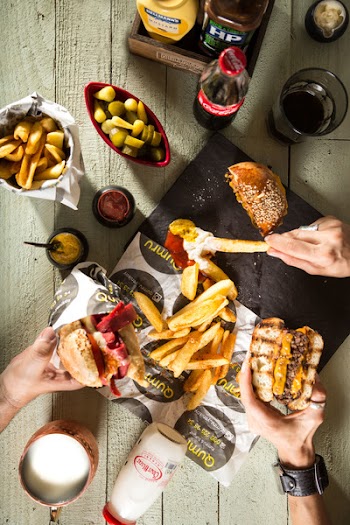 Two Person Holding Burgers
