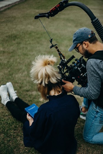 Two Person in a Green Field Close-up Photography