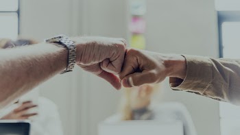 Two Person Making Fist Contact