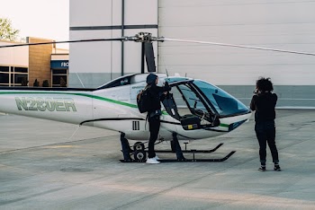 Two Person Near a Helicopter