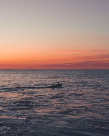 two person on boat sailing on sea