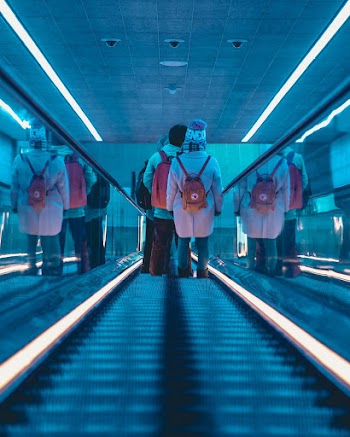 Two Person on Escalator