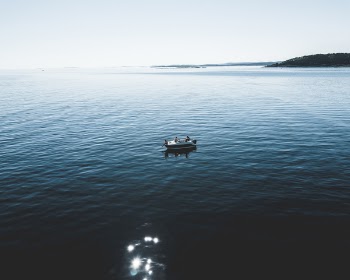 Two Person Riding Boat