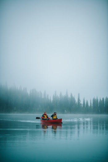 Two Person Riding Boat