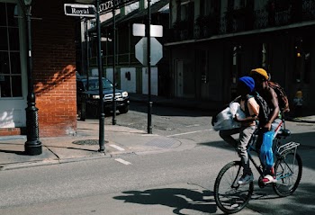 Two Person Riding on Bicycle