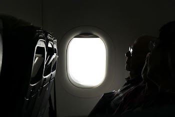 two person sitting inside of airplane