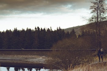 Two Person Standing Near Lake