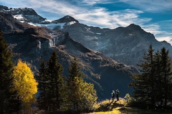 two person standing on mountain