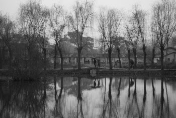 Two Person Walking on Bridge