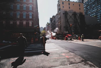 Two Person Walking on Pedestrian Lane