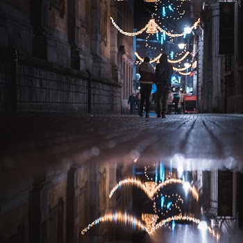 Two Person Walking on Street Corner