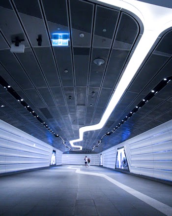 Two Persons Standing in Hallway