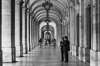 Two Persons Talking to Each Other on Hallway