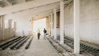Two Persons Walking Brown Floor