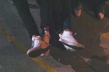 two persons wearing high-top sneakers